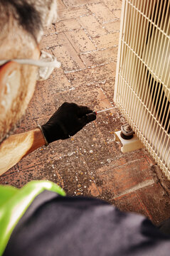 Technician performing maintenance check on HVAC unit