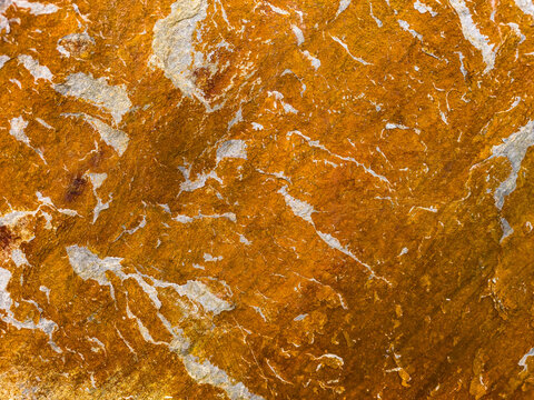 Abstract orange stone texture with natural marbled pattern
