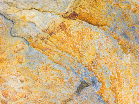Abstract stone texture background with rust and blue tones