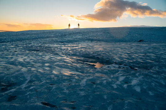 Glacier trekking on Vatnajokull at sunset in Iceland