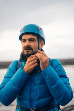 Glacier trekker preparing for Vatnajokull adventure, Iceland