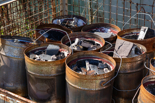Metal Bucket with hazardous waste for the recycling center