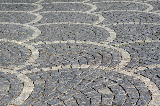 Paving stones laid in a scale formation during path construction