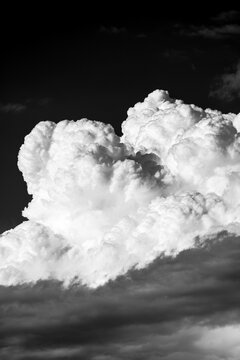 Dramatic storm clouds in black and white landscape