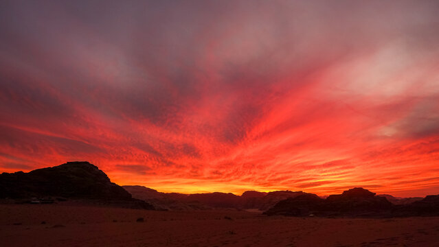 Fiery sunset over desert landscape during golden hour