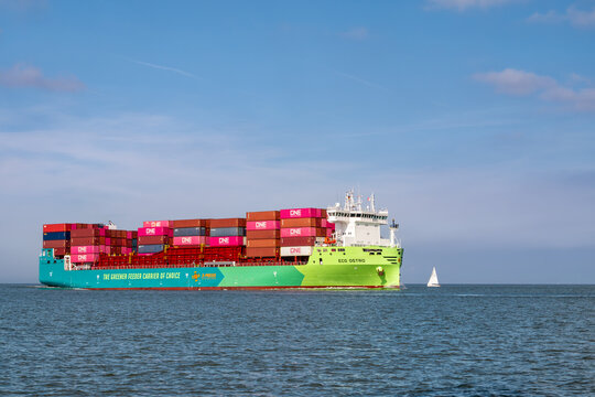 Modern eco-friendly container ship Eco Ostro sailing on Elbe Approach TSS, North Sea, Germany. This dual-fuel vessel uses green methanol to reduce carbon emissions in maritime transport