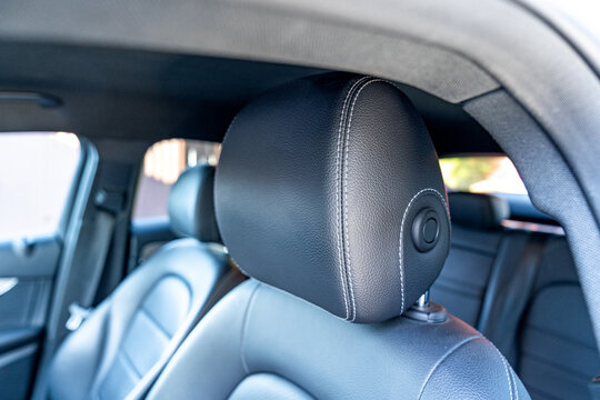 Close-up of luxury car seat headrest with leather detail