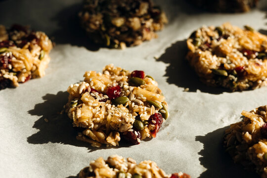 Homemade sugar-free seed cookies on parchment in light
