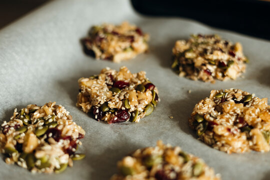 Homemade sugar-free seed cookies on parchment in light