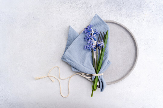 Spring hyacinth table setting with blue linen napkin