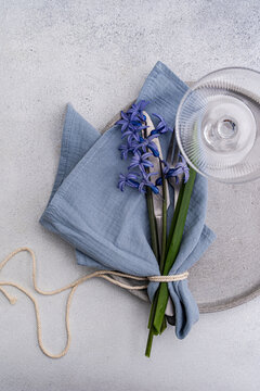 Blue hyacinth table setting with napkin and glassware