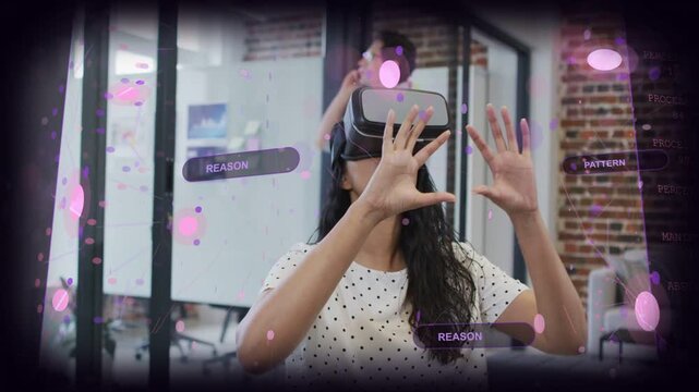 Woman raising finger and tapping REASON control, testing VR product and scaling purple UI nodes