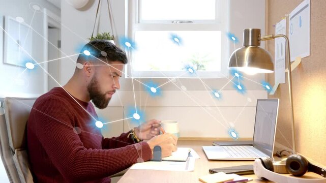Man writing at desk, pen tapping sparking blue node network overlay, aiding tech project notes