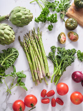 Fresh vegetables on marble countertop for healthy meal prep
