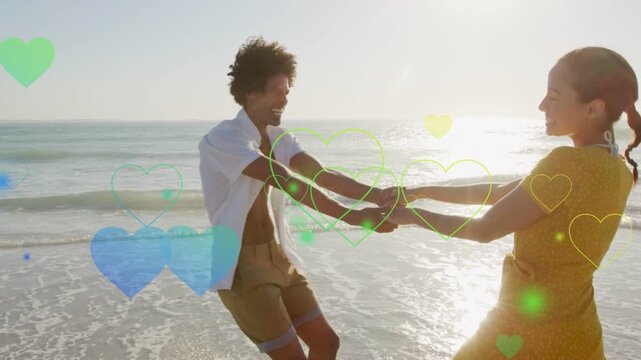 Couple holding hands initiating spin on beach, expressing love, animated hearts floating, marketing