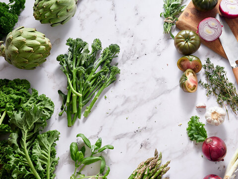 Fresh vegetables on marble countertop for healthy cooking