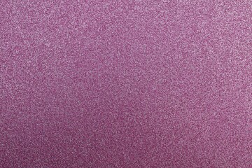 Fototapeta premium A beautiful close-up view of a textured, sparkly, glittery, lavender or lilac colored surface, providing a festive and decorative background for various design projects