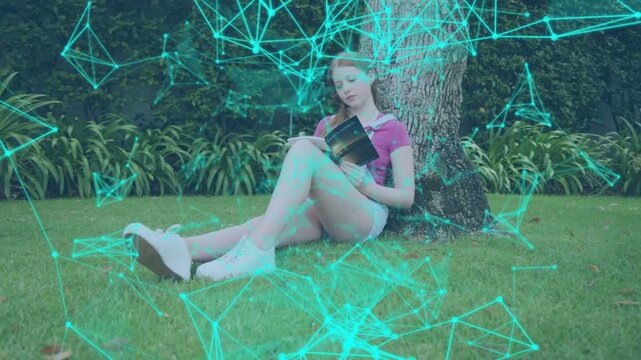 Female reader leaning against tree, reading for education, teal network drifting and obscuring book