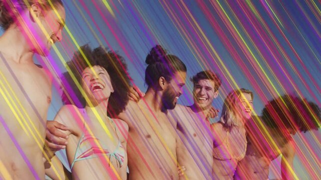 Friends linking arms on beach for travel ads, camera panning revealing faces under colored streaks