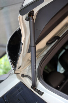 Portrait of a new SUV trunk lid strut