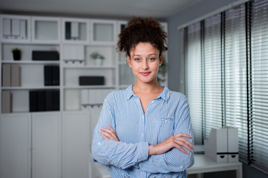 Portrait of young Latina businesswoman working in the modern office. 