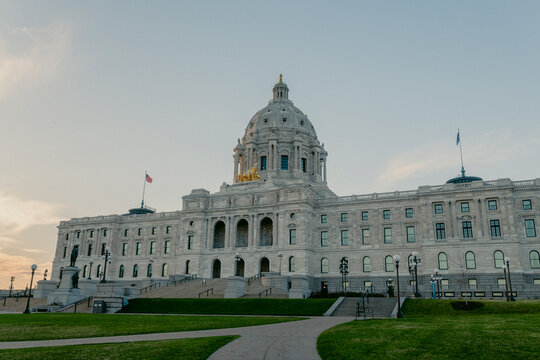Wide view of Minnesota State Capitol building with pathways.
