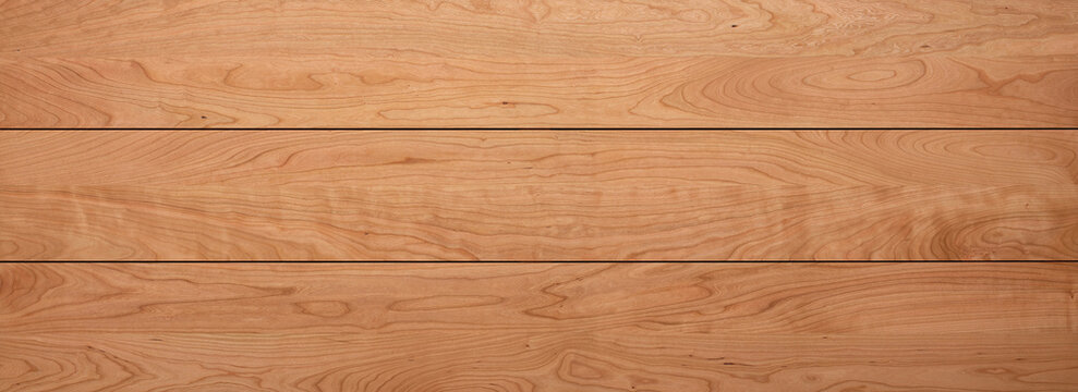 Cherry wood solid wood long tabletop. Solid wood tabletop background. Cherry wood plank texture. wooden texture background