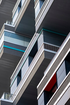 Strong perspective lines define Paris France modern residential apartment facade with balconies presenting urban architecture on a clean exterior elevation