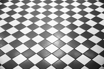 black white tiled checkered floor shows perspective and reflection Black and white tile floor, worn...