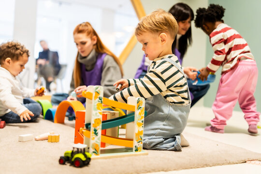 Children playing with toys at an indoor daycare center