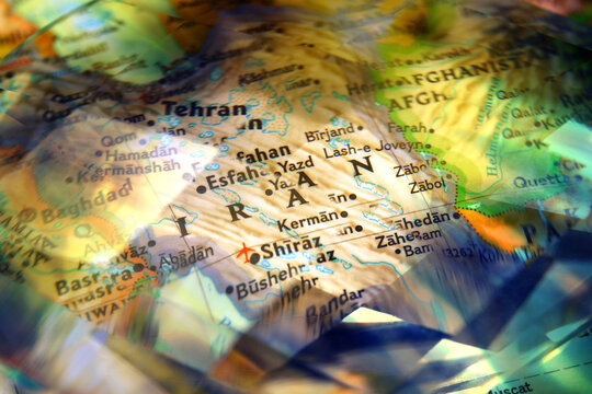 Faceted crystal glass refracting map of Iran and Middle East