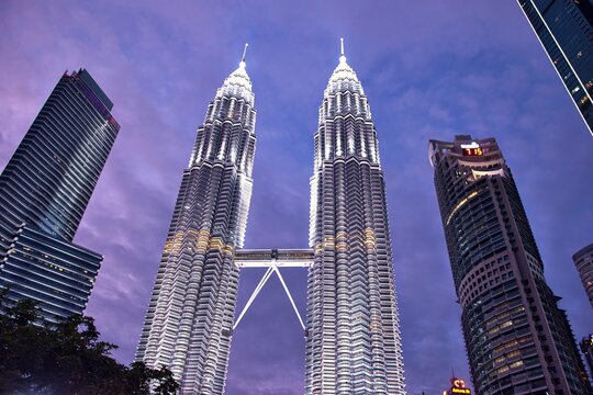 KUALA LUMPUR, MALAYSIA - JULY 18, 2023: Petronas Towers. Petronas Towers, also known as Menara Petronas is the tallest buildings in the world from 1998 to 2004.