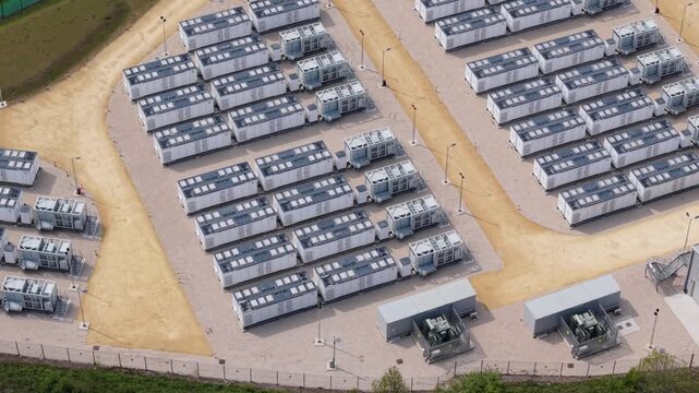 Close up aerial view of modular Sungrow battery energy storage systems BESS units in rows near Ferrybridge UK