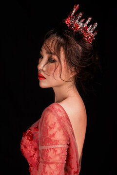 Sexy Asian wedding dress woman against a black background