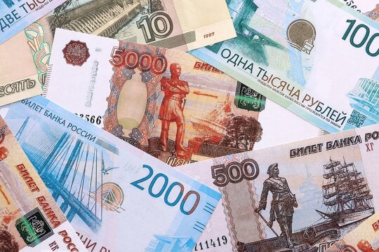 Russian ruble money bills pile on table. Russia banknotes of RUB currency close up.