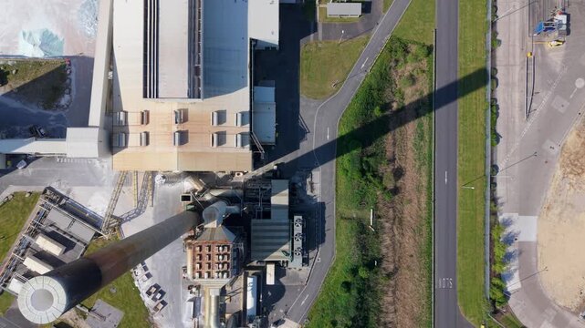 Aerial view of a large glass recycling and manufacturing facility with industrial processing plants and cooling fans in Goole, East Yorkshire, UK.