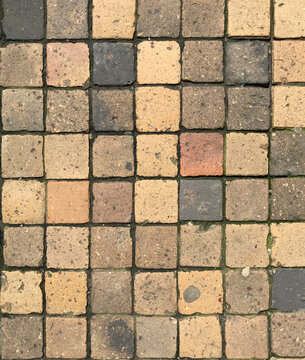 Overhead View of Weathered Square Stone Cobblestone Pavement Pattern