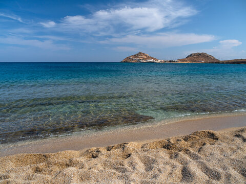 View from Kalafati beach to the fishing village on the island of Mykonos in Greece