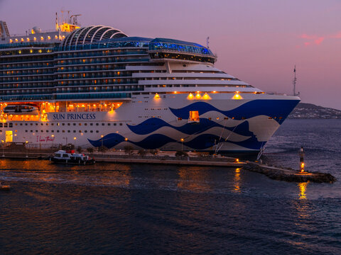 Mykonos, Greece, August 20, 2024: Cruise ship at the port on the island of Mykonos in Greece at sunset