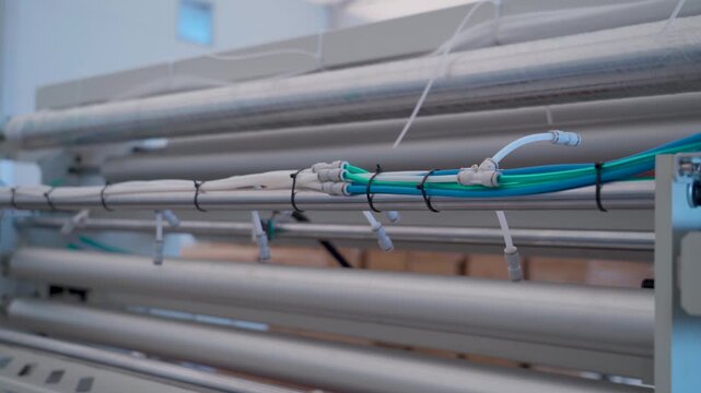 Industrial Pneumatic Hoses and Cable Carrier on Automated Machine