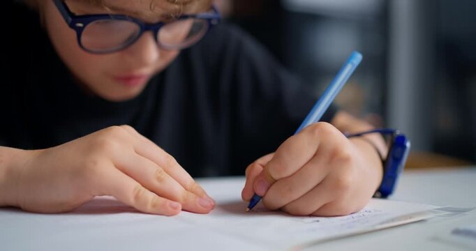 Student Pays Attention To Homework. Child Dedicates Careful Attention To Completing School Assignments