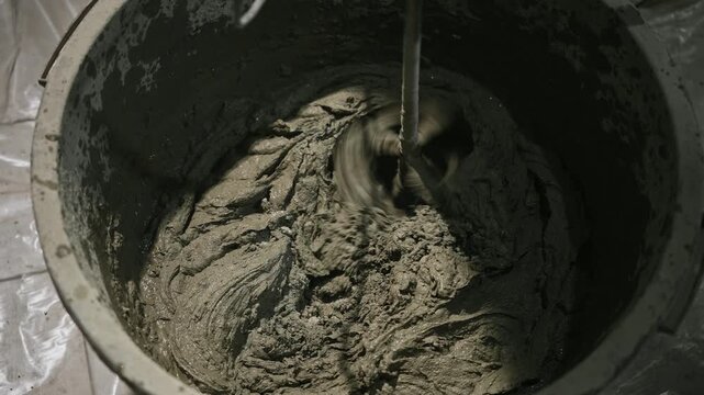 Showcasing Thorough Mortar Mixing Techniques Emphasizing Surface Finishing And Detailed Craftsmanship