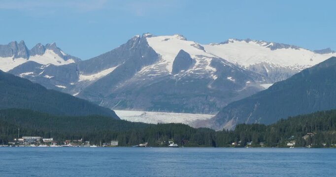 Beautiful sunny summer day in Juneau, Alaska.Mendenhall Glacier and the surrounding mountains covered by snow.