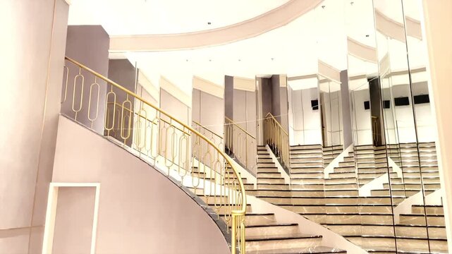 Modern luxury marble staircase with gold railing in house interior