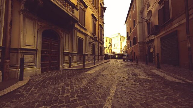 sunlit opening at end of alley with cobblestone foreground, bright piazza beyond narrow corridor, warm horizon glow, inviting travel perspective and scenic