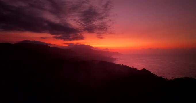 Vibrant aerial sunset view over Tayrona Los Naranjos coastline in Colombia
