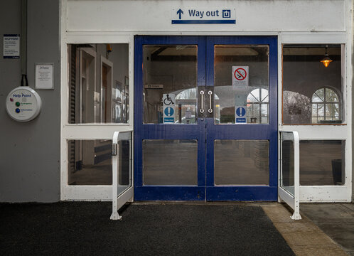 Way Out Sign and exit doors at Thurso Railway Station., Scottish Highlands,  Caithness,  Scotland, UK