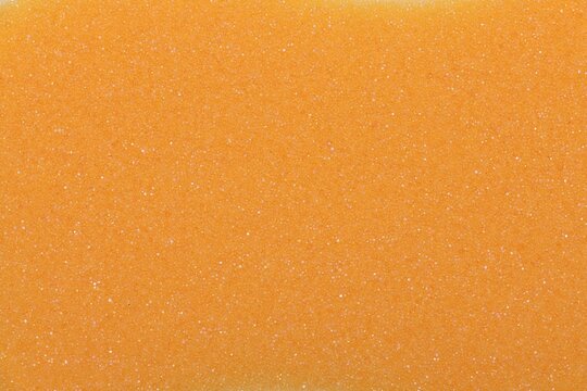 Orange foam sponge sheet texture background	