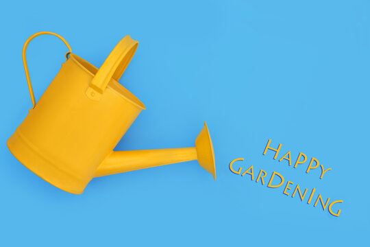 Happy gardening concept with yellow metal watering can for indoor or outdoor and patio gardening use with text. Classic garden tool design on blue background.