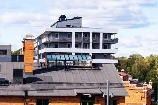Modern residential apartments sit on a rooftop building in urban Stockholm Sweden as Scandinavian architecture shapes contemporary housing in Scandinavia